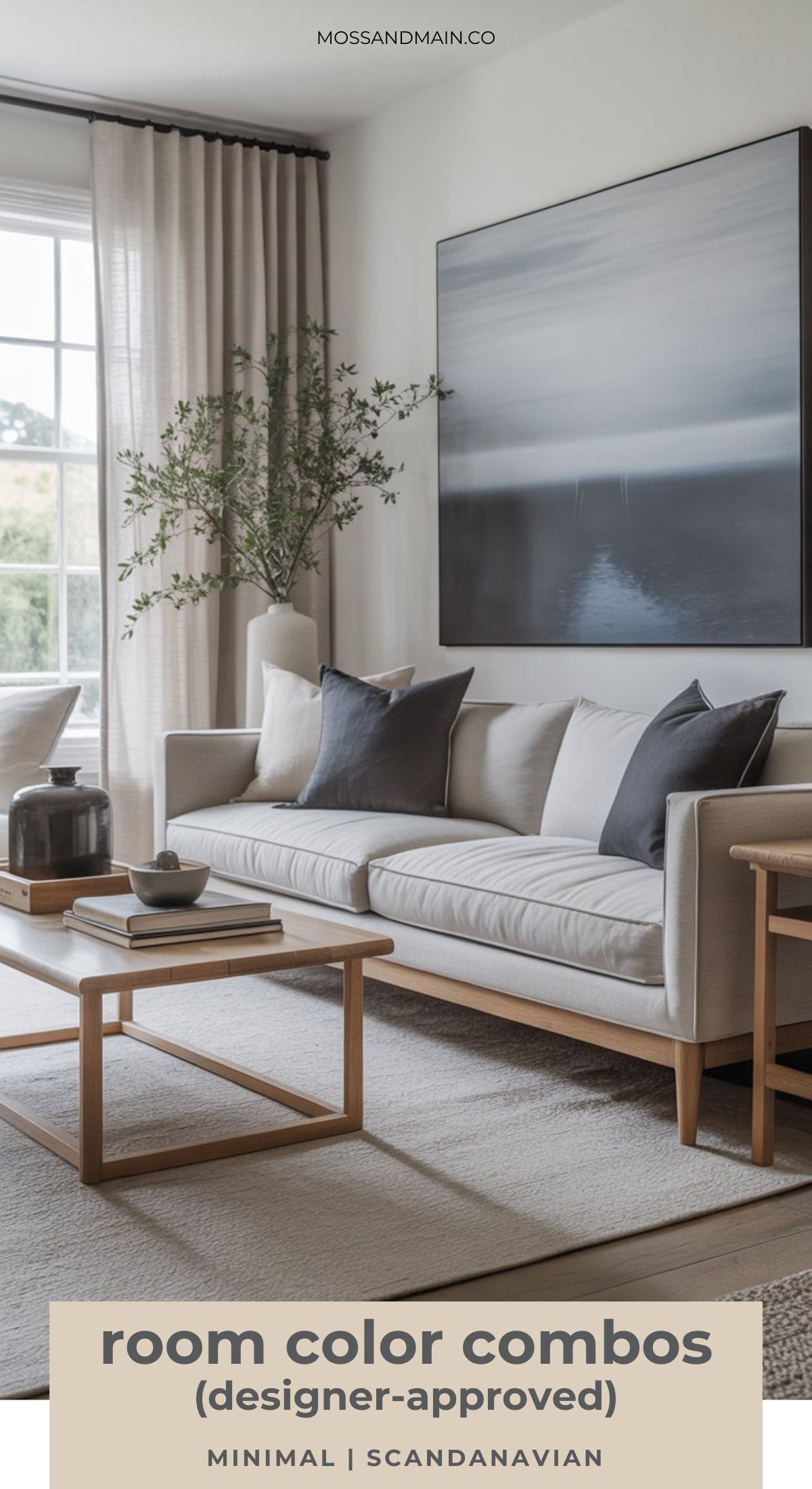Minimal Scandinavian living room with a light gray sofa, black and gray pillows, wooden coffee table, potted plant, large abstract wall art, and soft natural light—showcasing timeless color palettes designer-approved for modern interior design. Room color combos.