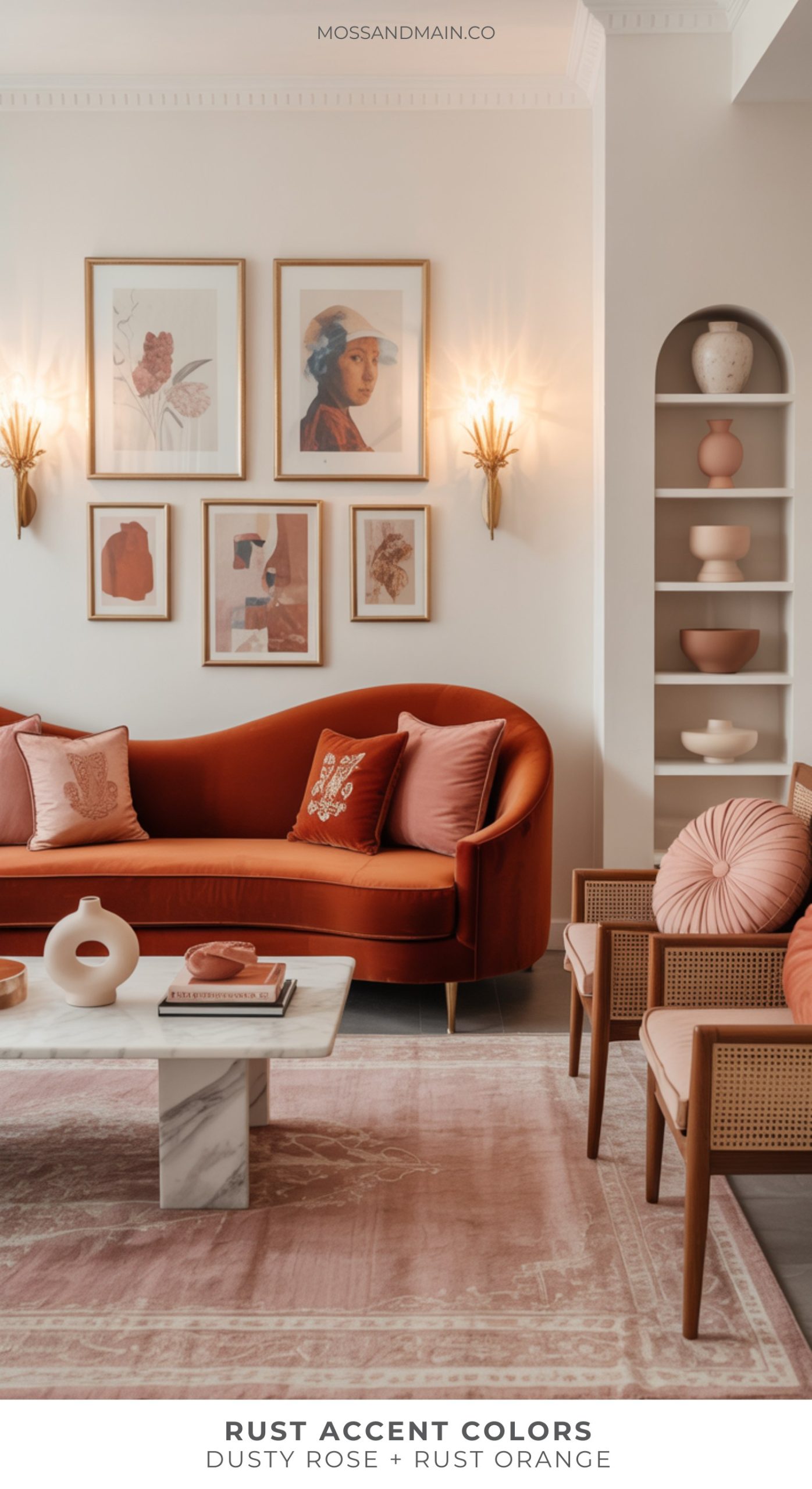 A stylish living room with a rust orange sofa, dusty rose and rust accent pillows, cane chairs, wall art, and a marble coffee table. Warm lighting and neutral walls highlight the cozy, modern look with chic rust home decor.