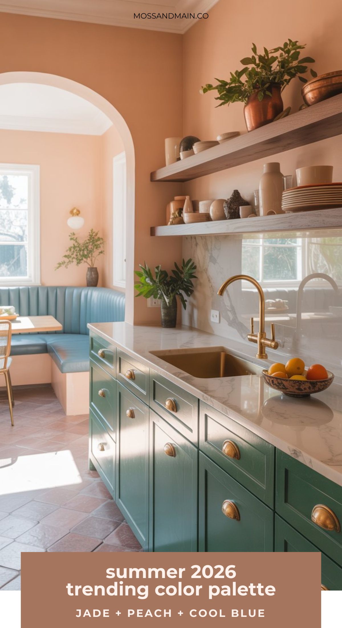 A stylish kitchen features jade green cabinets, brass fixtures, a marble countertop, and a built-in blue banquette. Peach-colored walls and natural light create a warm, inviting atmosphere. Text reads: summer 2026 trending color palettes.