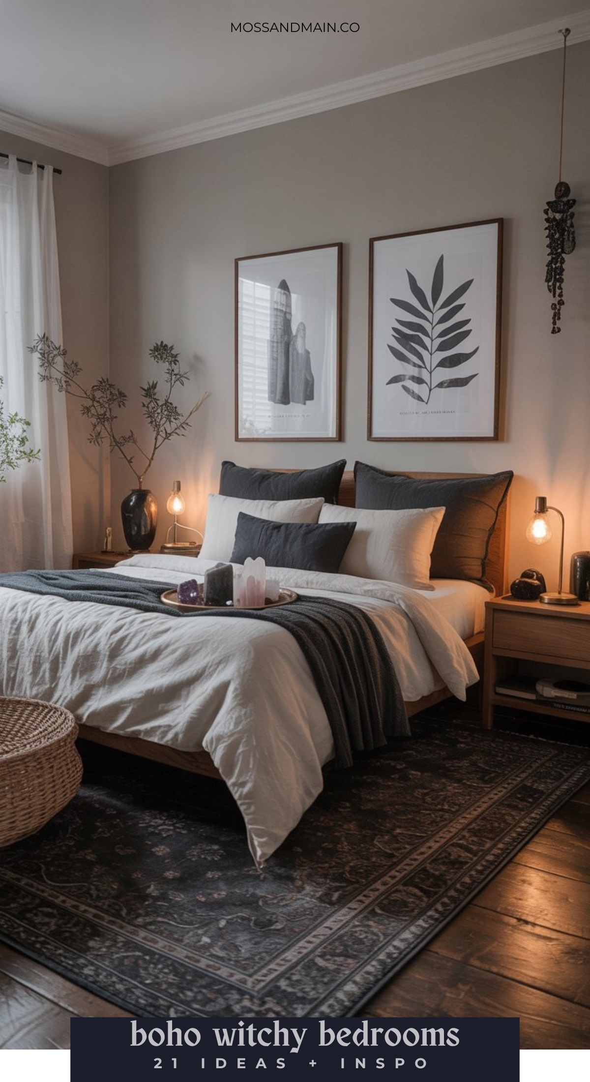 A cozy bedroom with boho witchy decor, featuring a neatly made bed with black, white, and gray bedding, botanical wall art, warm lighting, plants, crystals, and candles on wooden nightstands—perfect for witchy bedroom ideas. A patterned rug covers the floor.