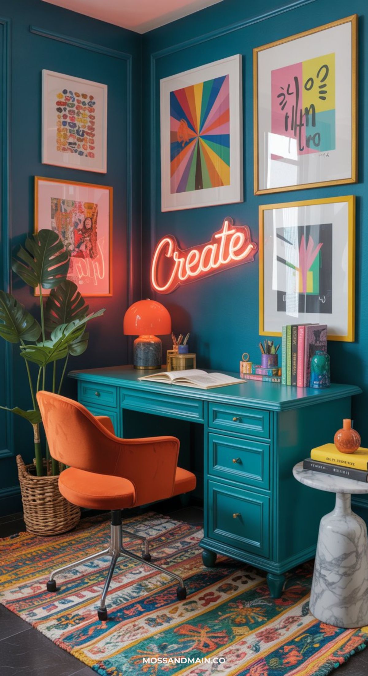 A vibrant maximalist office décor features teal walls, a teal desk, and an orange chair. Colorful framed art and a neon “Create” sign hang above the desk, while a plant, books, art supplies, and a patterned rug add bold personality.