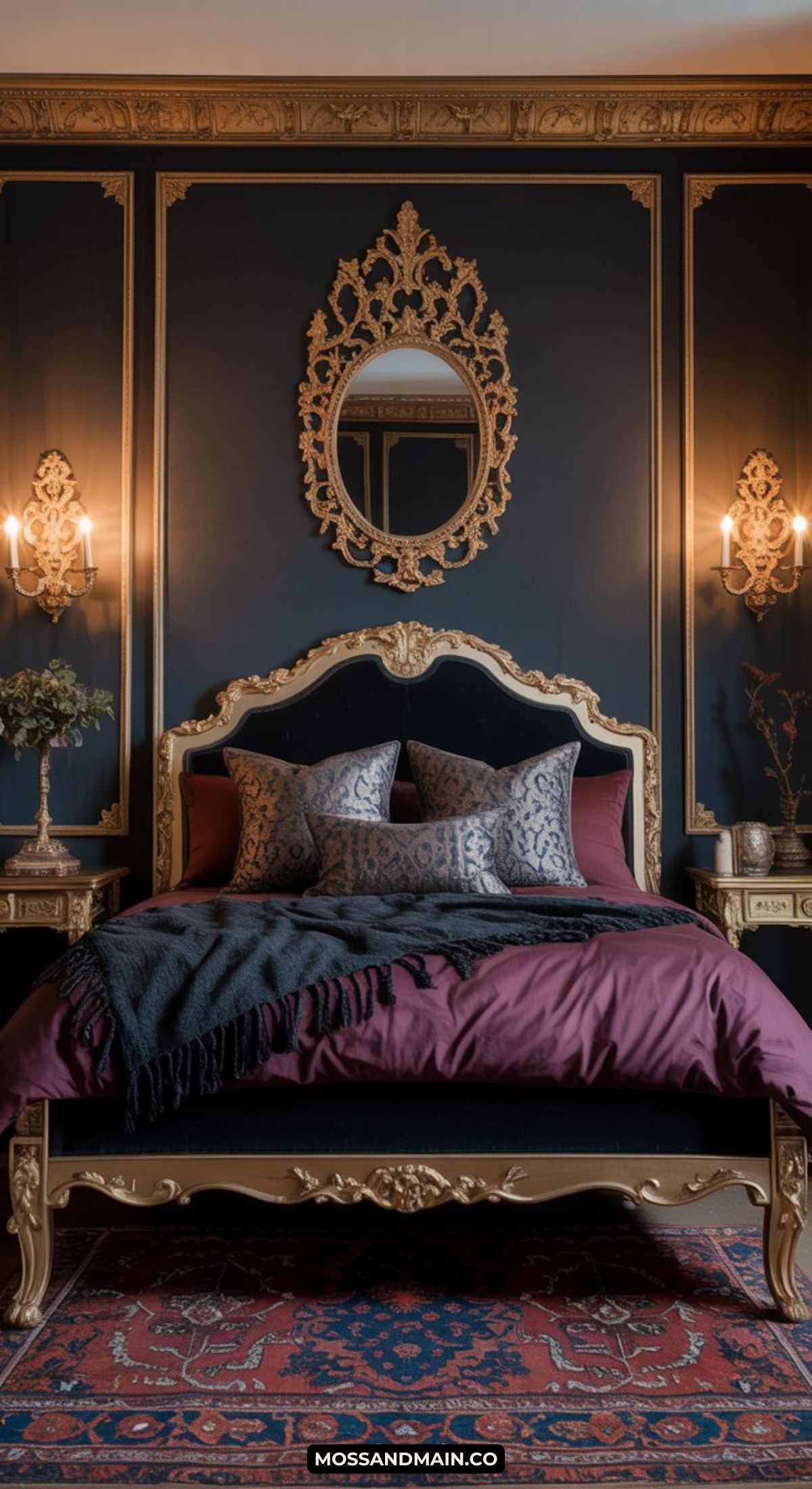 Luxurious masquerade bedroom with ornate gold-trimmed bed and headboard, deep navy walls, gold-framed mirror, decorative wall trim, matching side tables, wall sconces, patterned pillows, and a rich burgundy comforter.