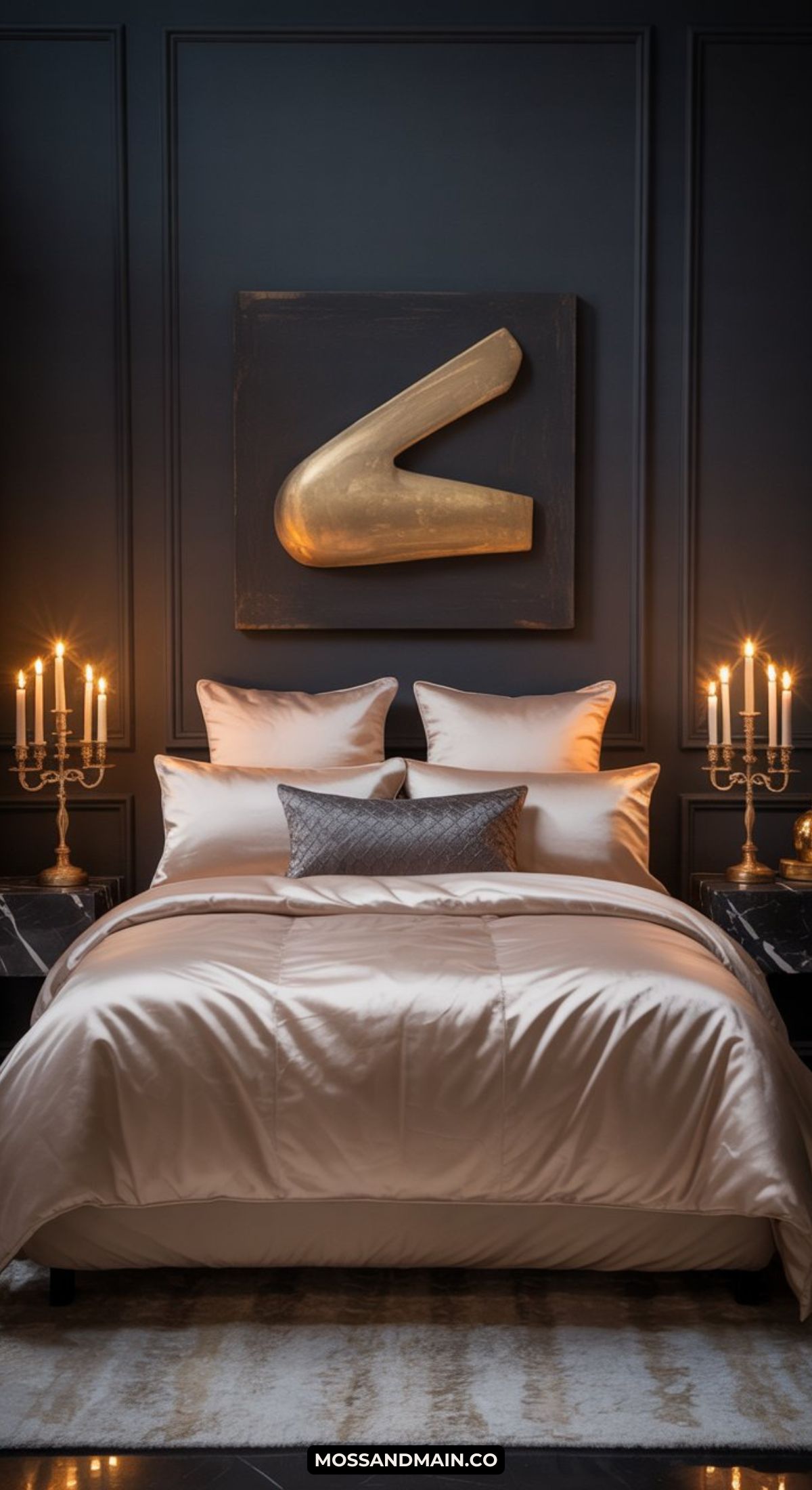 A luxurious masquerade bedroom with dark paneled walls, a plush bed featuring cream bedding and gray accent pillows, two lit candelabras on bedside tables, and a large gold abstract wall art above the headboard.