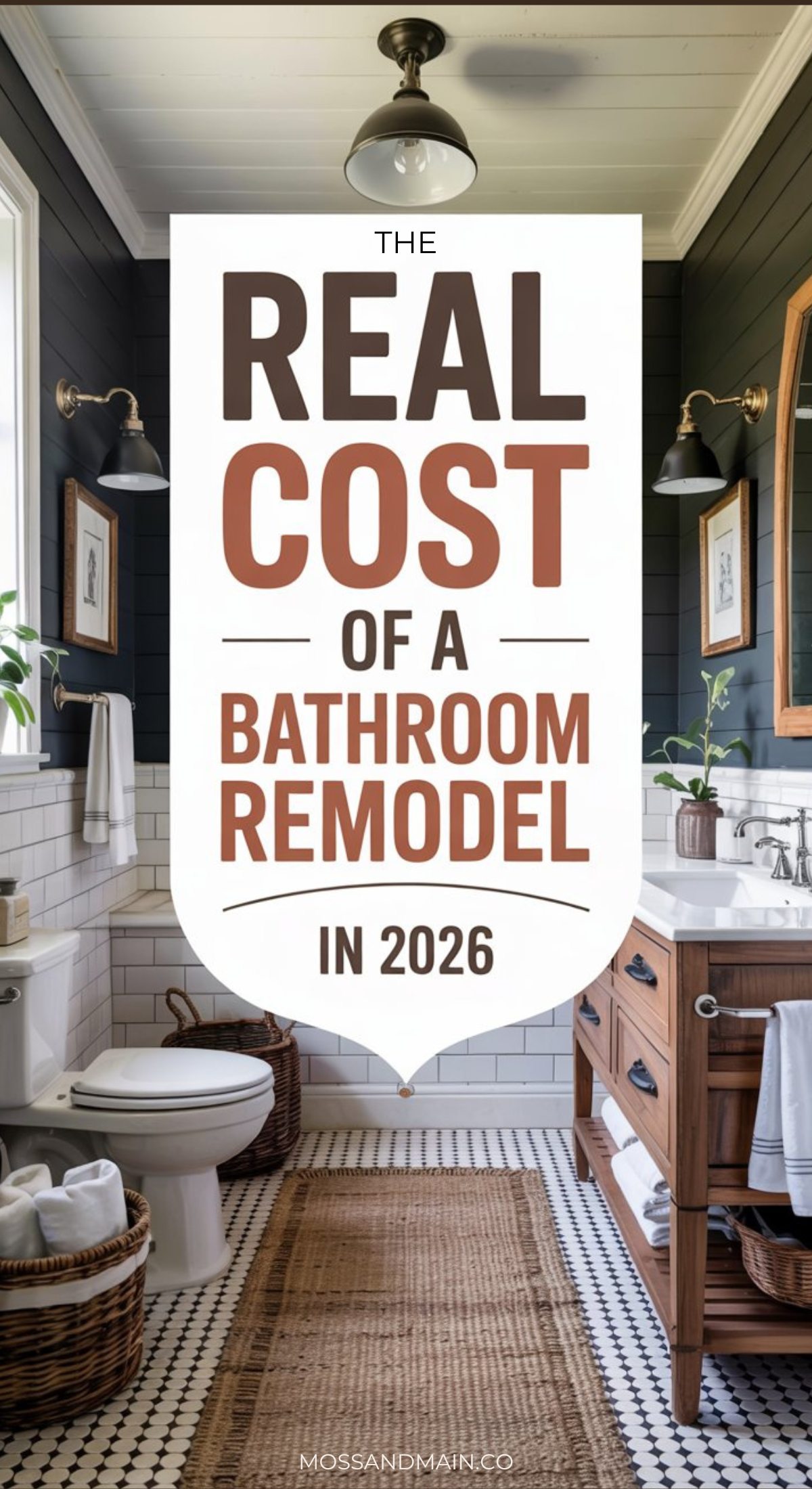 A stylish bathroom with dark walls, two mirrors, a wooden vanity, and a white toilet. Text reads: “The Real Bathroom Remodel Cost in 2026.” Decor includes plants, towels, and wall lamps.