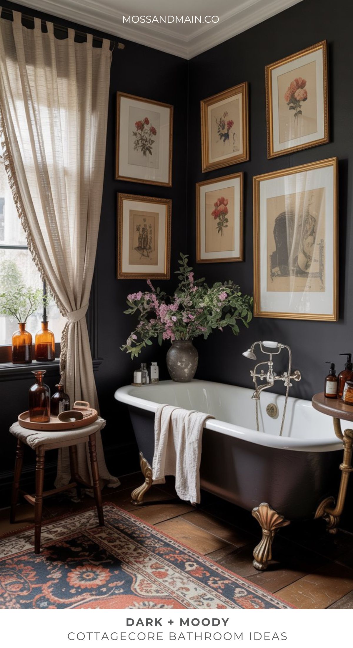 A dark, moody bathroom with a vintage clawfoot tub, ornate rug, floral wall art, and brown glass bottles offers timeless bathroom appeal. Fresh flowers, a wooden stool, and sheer curtains filtering natural light complete the look.