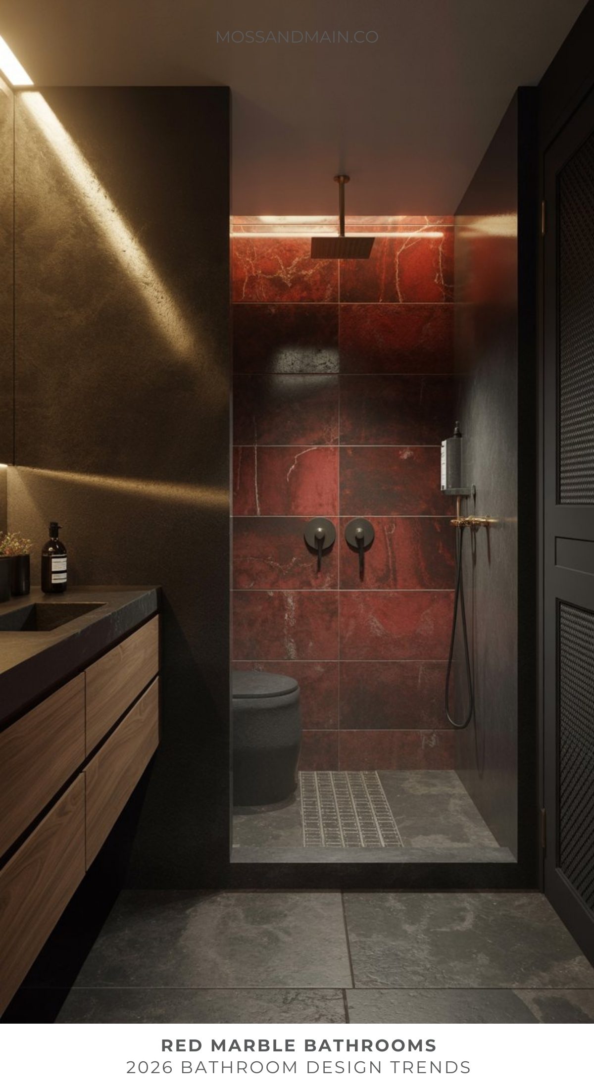 A bold bathroom with striking red marble tiles in the shower, matte black fixtures, a dark vanity with wood drawers, and soft, warm lighting. Text reads Red Marble Bathrooms — 2026 Bathroom Trend.