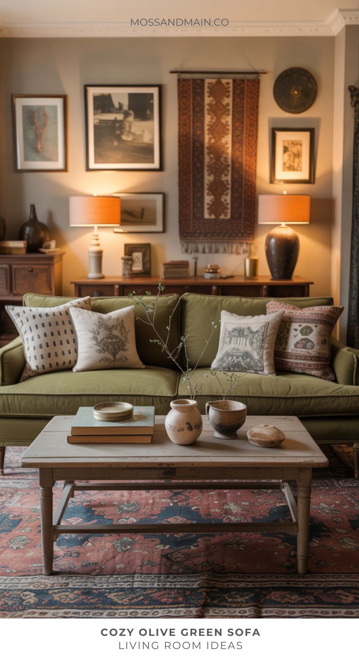 A cozy living room features an olive green sofa with patterned throw pillows, a wooden coffee table with decorative items, warm lighting, and eclectic wall art—perfect for anyone seeking inspiring living room ideas in interior design.