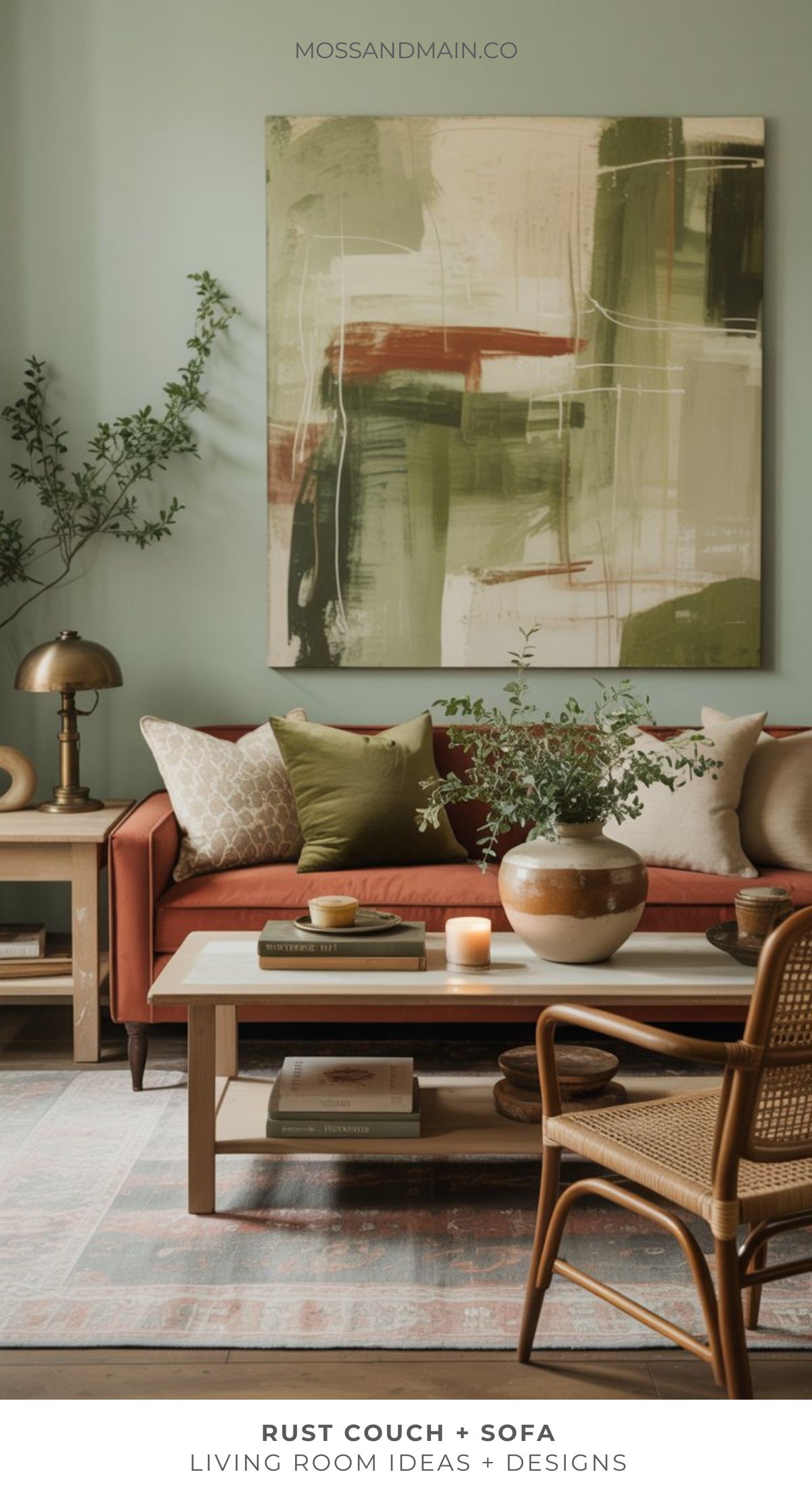 A cozy rust couch living room with neutral pillows, a wooden coffee table adorned with decor, a potted plant, and abstract green wall art, creating a warm and inviting atmosphere.
