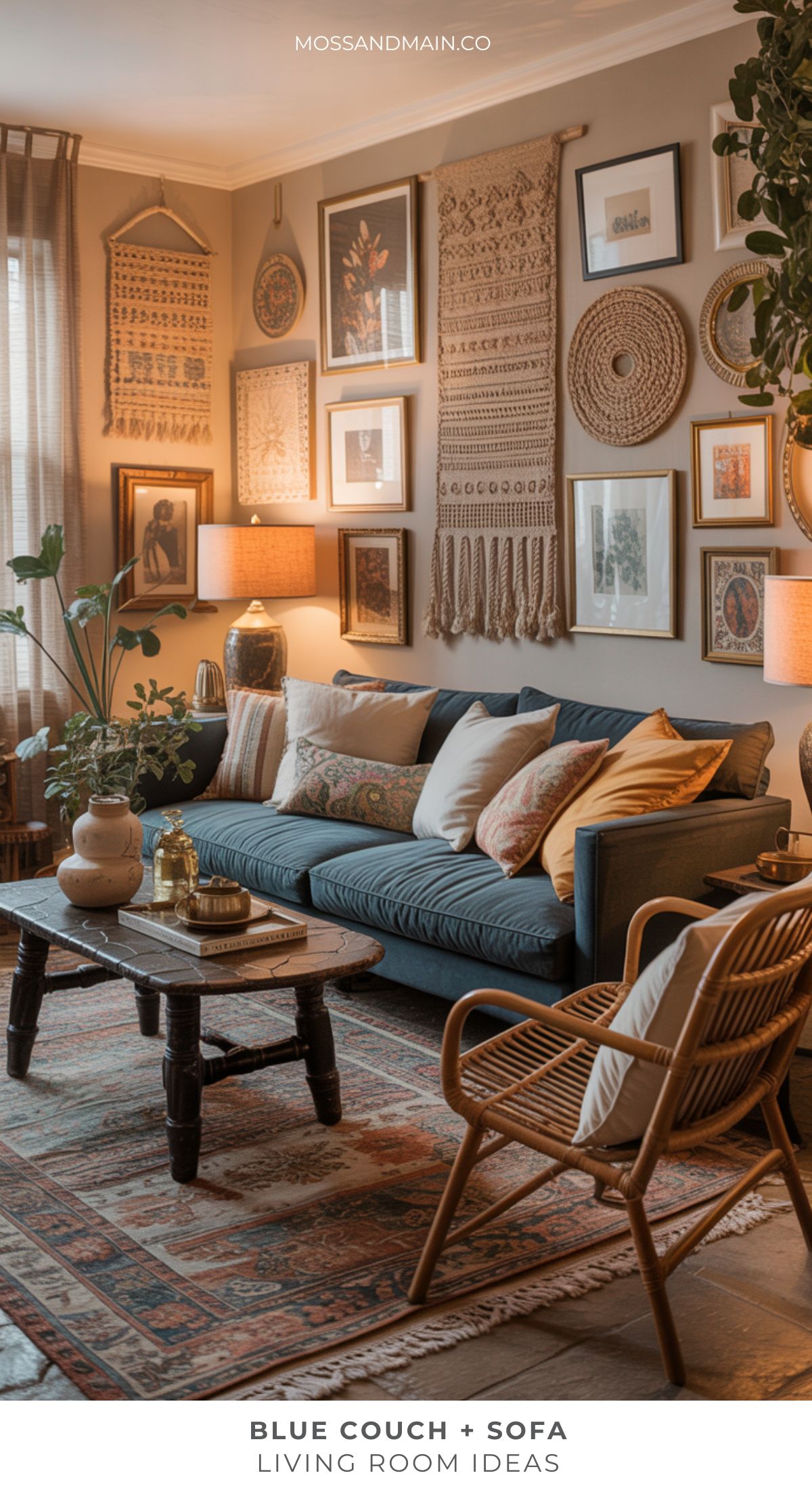 Cozy living room ideas shine here with a blue couch, patterned pillows, rattan chairs, and warm lighting. Framed art, woven hangings, and plants complete the inviting space with touches of dramatic decor.