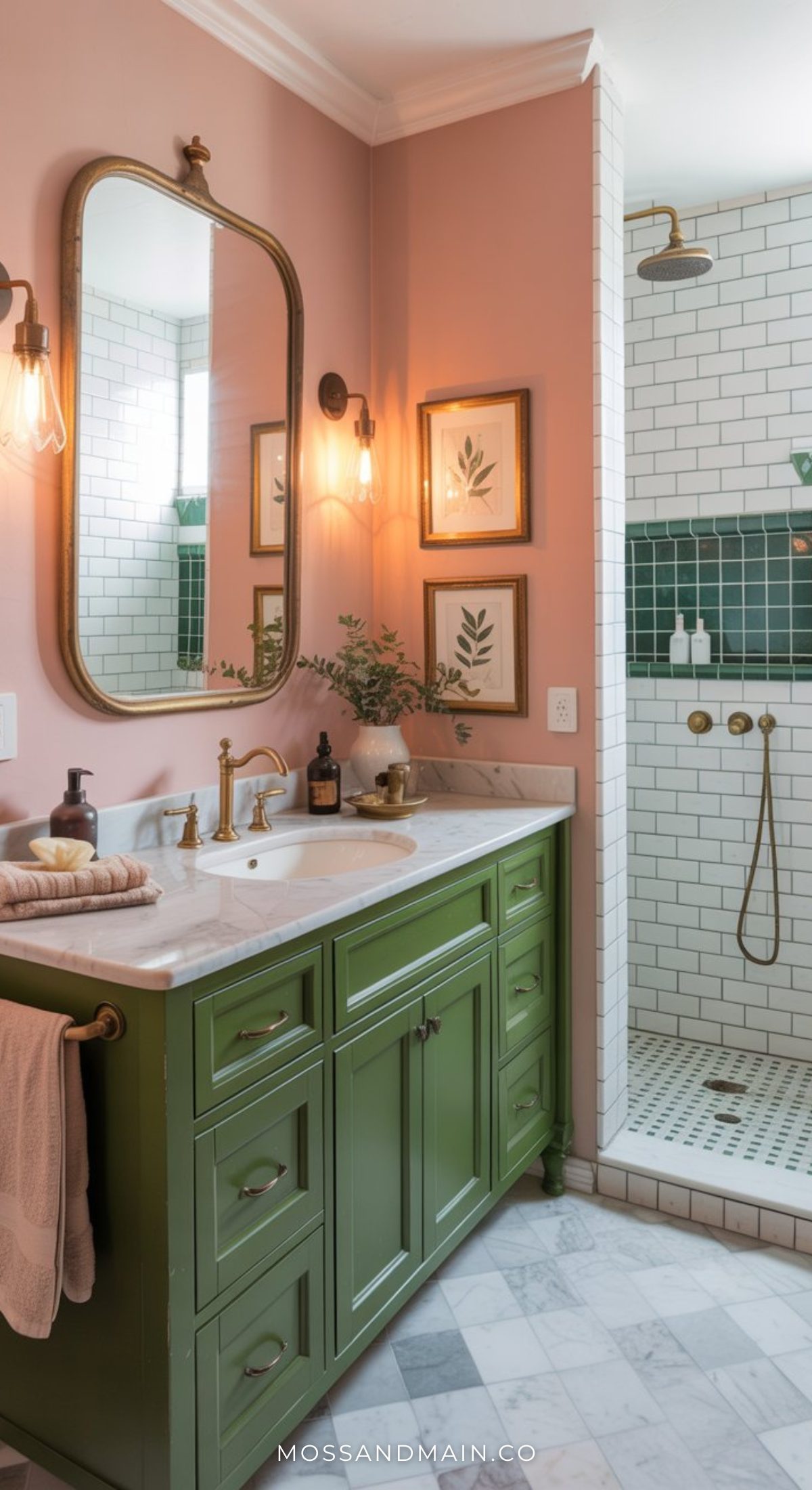 A stylish bathroom featuring a green vanity, marble countertop, gold fixtures, a large mirror, pink walls, and botanical prints—perfect inspiration for Pink Bathroom Ideas and anyone who loves Bold Bathrooms with unique accent tiles.