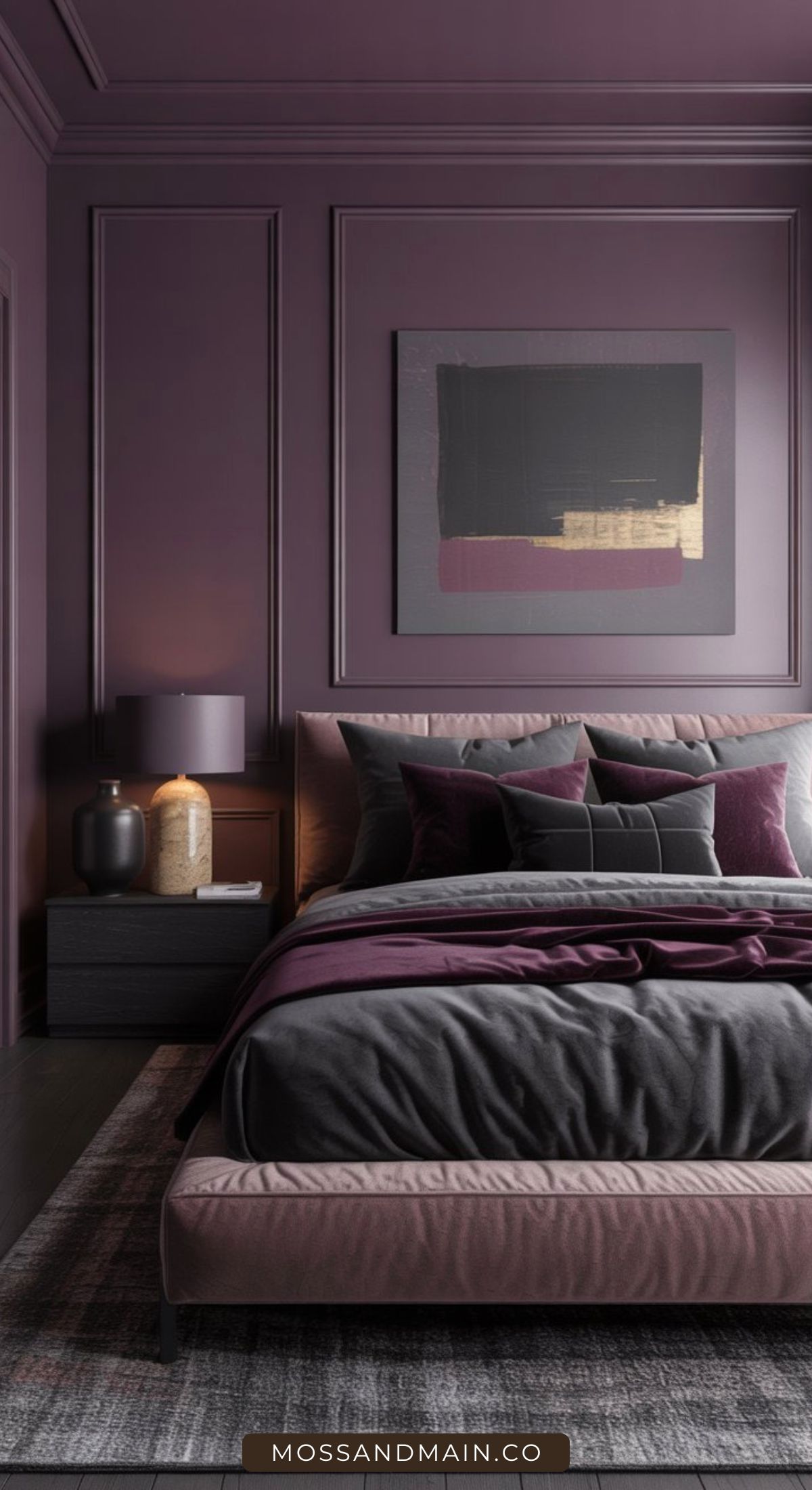 A modern bedroom with plum-colored walls, a matching bed with dark bedding and purple accent pillows, a nightstand with a lamp and vase, and abstract artwork above the bed. The room has a cozy, sophisticated feel.