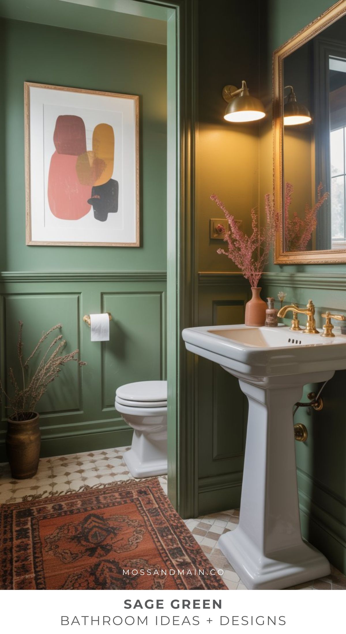 A timeless bathroom in sage green features a pedestal sink, brass fixtures, an ornate mirror, abstract wall art, a patterned rug, and a potted plant for a cozy atmosphere with gold accents and classic paneled walls.