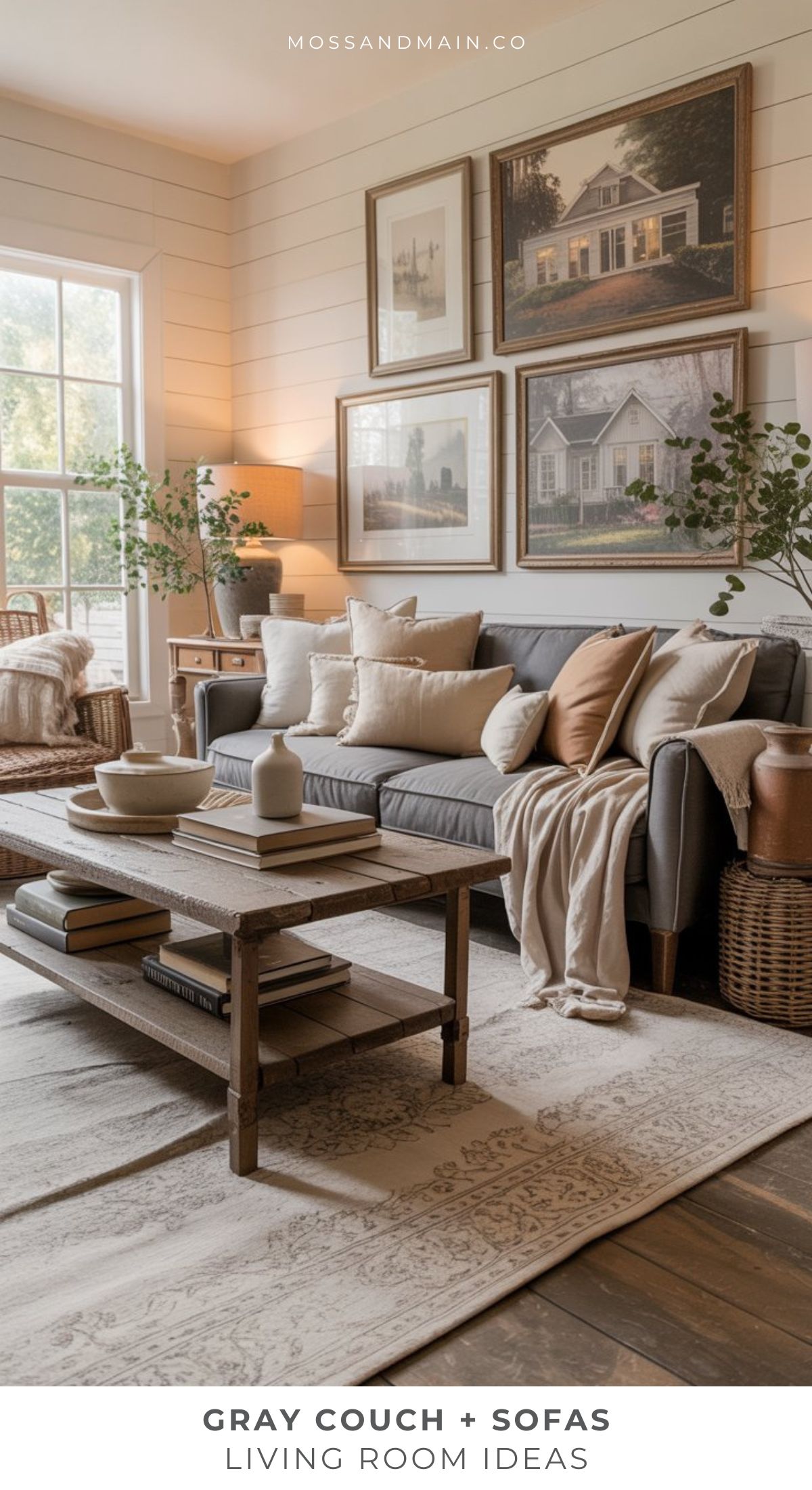 A cozy gray couch living room with neutral throw pillows, a wooden coffee table, framed art, indoor plants, and large windows full of natural light. Text reads “GRAY COUCH + SOFAS LIVING ROOM IDEAS.”.