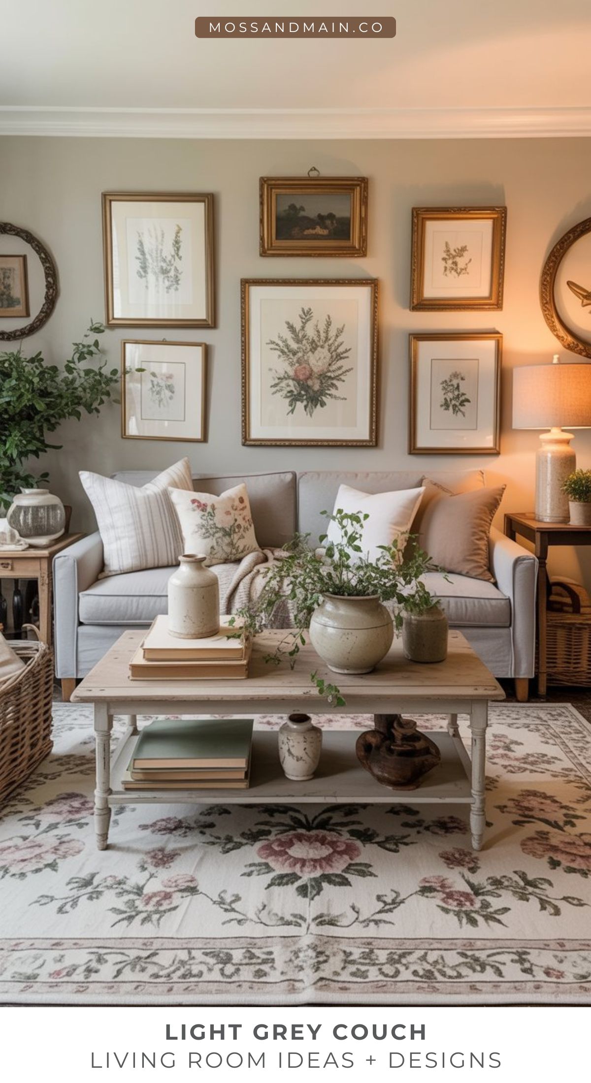 A cozy living room featuring a light gray couch, neutral pillows, a wooden coffee table with plants and books, floral art on the walls, and soft, warm lighting—perfect for anyone seeking rustic yet elegant living room ideas with nature-inspired accents.