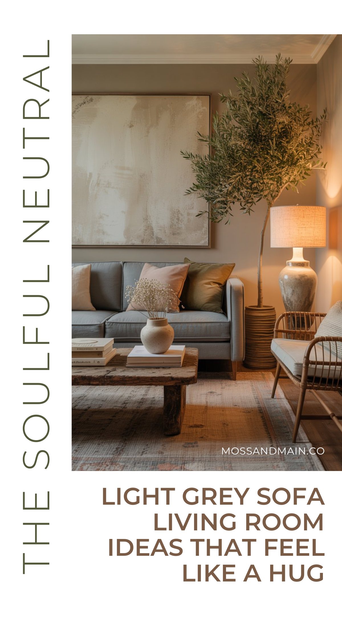 A cozy light gray couch living room with neutral pillows, a wooden coffee table, large abstract wall art, a warm table lamp, and potted plants creates a calm and inviting atmosphere. Text reads: The Soulful Neutral.